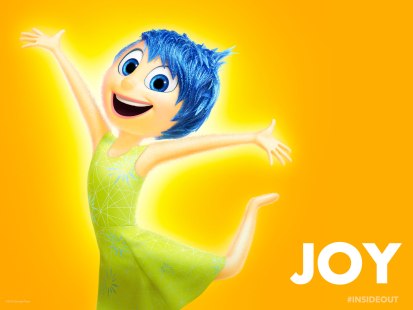 According to Pixar, Joy was modeled after a star: slim, pointy and bright. She even glows. This is because she's the star of Riley's head and the leader of her emotions. her look has nothing to do with her being rich or whatever. She's a freaking EMOTION. They all reside together inside a kid's head.